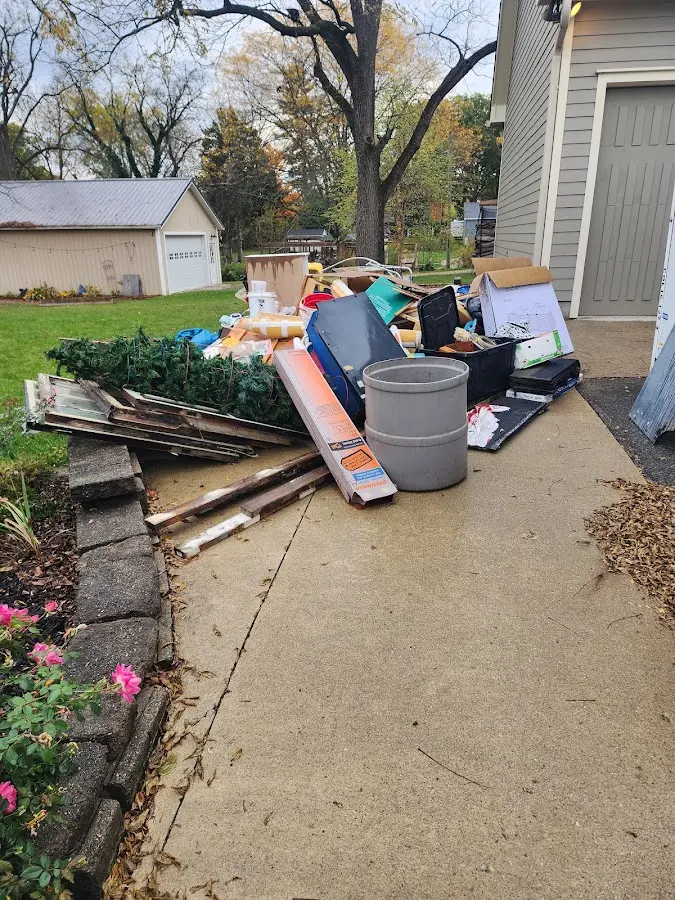 Dumpster being loaded with debris for 3 Yard Dumpster Rental in Goldendale
